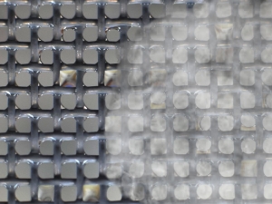Photo illustration of fog on steel nanoengineered mesh used for harvesting and purifying water droplets.