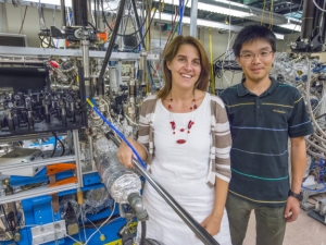 image of woman and man standing in front of lab machine