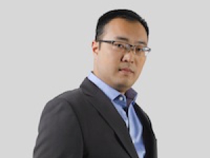 Daniel Nomura standing at 3/4 angle