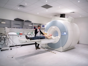 image of someone going into an MRI 