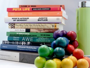 a stack of about a dozen books by UC Berkeley authors