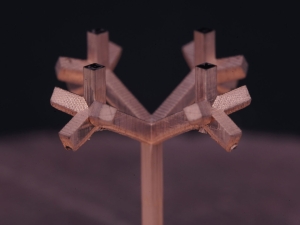 A 3D fractal tree antenna fabricated using charge programmed multi-material 3D printing (CPD).
