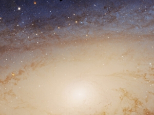 a bright yellow spot amid stars, with a blue background of stars