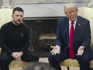 Ukrainian president Zelensky is seated next to President Trump