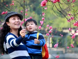 mother and child looking up with smiles