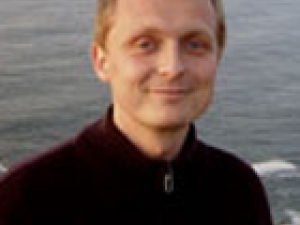 headshot of Michael Rape in outdoor setting