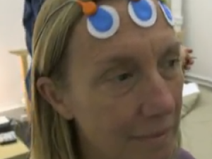 woman with probes on her forehead 