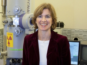 Jennifer Doudna in lab sitting on desk