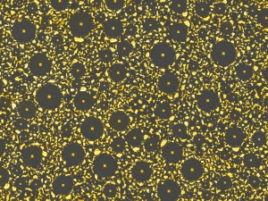 microscopic view of gold irregular shapes on a black background